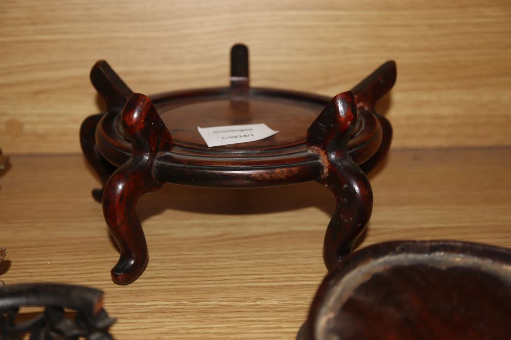 Nine various Oriental hardwood stands